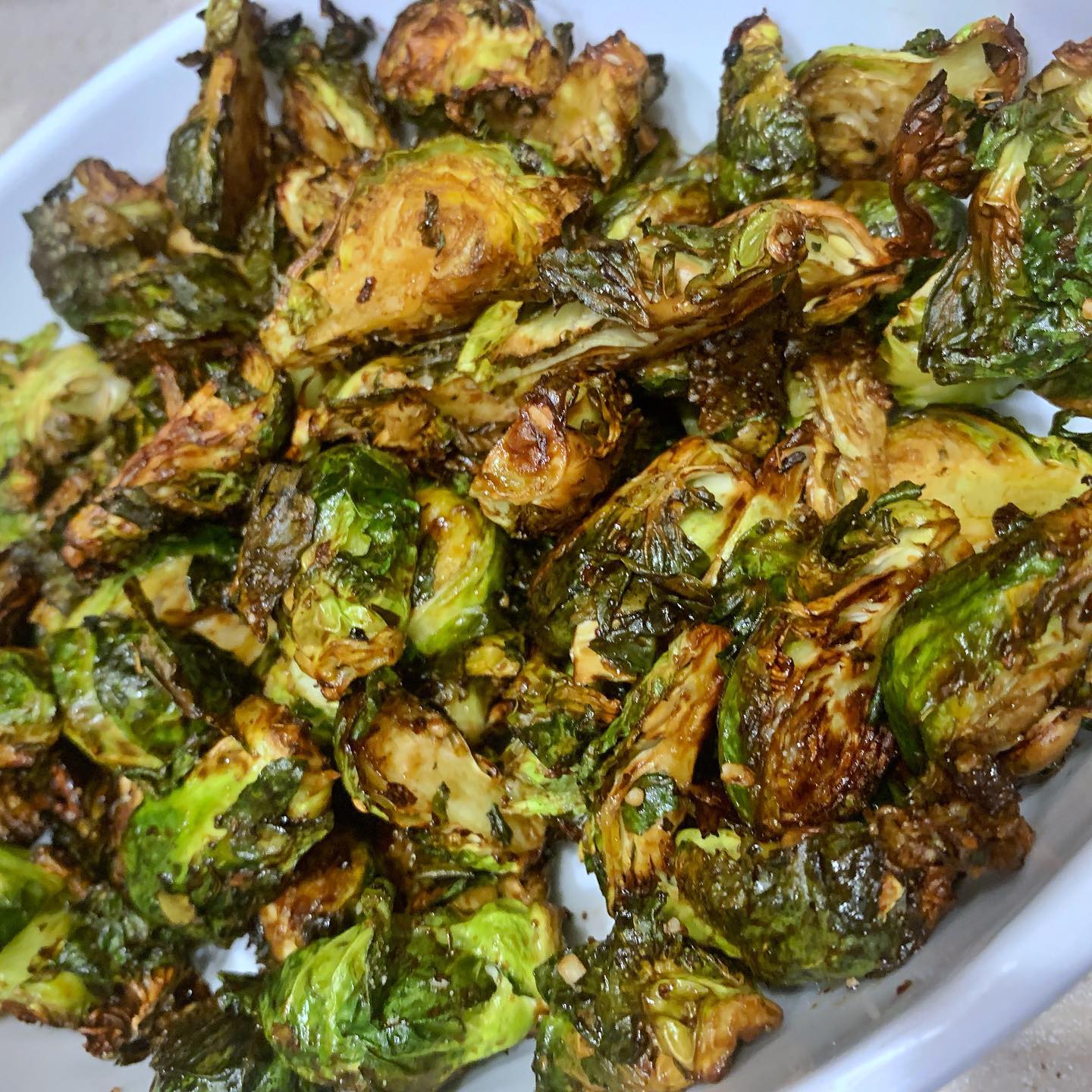 Air-fryer Brussel sprouts with orange balsamic glaze for the win 🙌 
Check out our wing-it recipe below 👇 

⛔️ measurements are approximate because it’s all about the flavor you’re hoping to achieve.)

1lb fresh  #brusselsprouts cut in half

Put cut pieces in #airfryer fryer basket, spray lightly with avocado oil. Toss with seasoning. 

Our seasoning of choice - @pamperedchef season salt and  3 onion rub (add as much as you’d like for taste) 

Air fry 400* 15 min
Toss halfway through

Add 1-2 t fresh minced garlic and a few shakes (or 10 😉 ) of grated Parmesan cheese, toss and cook 3-4 more minutes at 400*

Sauce - 1/4 c balsamic glaze
1T low sodium soy sauce 
1-2t orange juice (no pulp)

Toss in glazed and eat it up! 😋