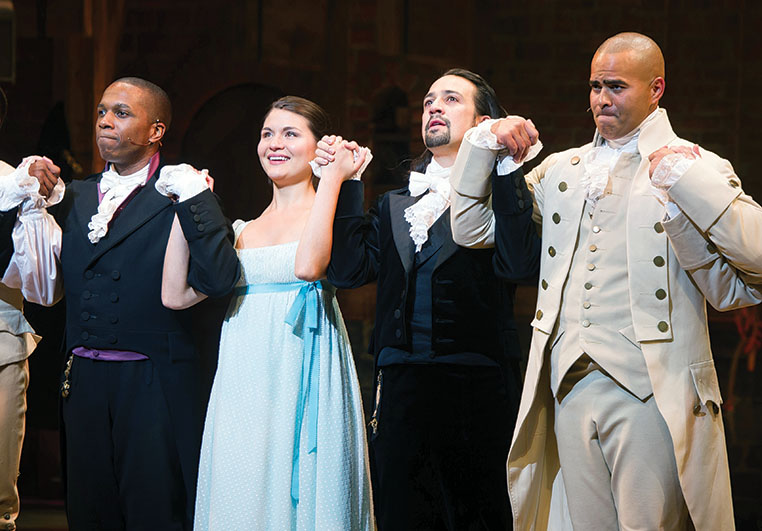 Leslie Odom Jr., from left, Phillipa Soo, Lin-Manuel Miranda and Christopher Jackson appear at the curtain call following the opening night performance of "Hamilton" at the Richard Rodgers Theatre on Thursday, Aug. 6, 2015, in New York. (Photo by Charles Sykes/Invision/AP)