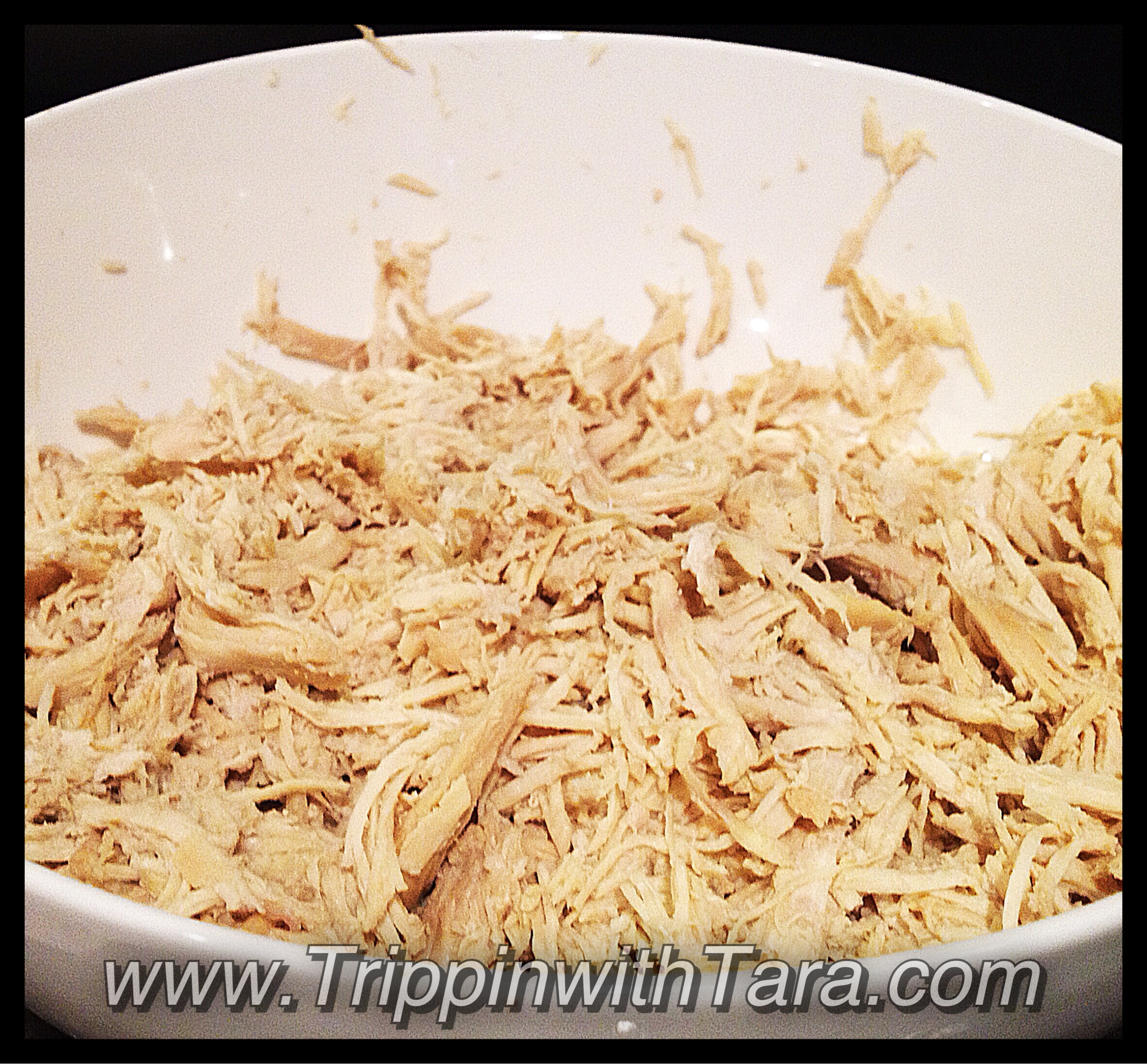 Cook boneless chicken breast in chicken broth in the slow cooker